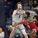 
              Loyola Marymount guard Jalin Anderson (0) passes the ball past Gonzaga forward Drew Timme (2) during the second half of an NCAA college basketball game, Thursday, Jan. 19, 2023, in Spokane, Wash. Loyola Marymount won 68-67. (AP Photo/Young Kwak)
            