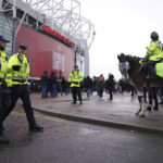 
              Police patrols outside the stadium before the English Premier League soccer match between Manchester United and Manchester City at Old Trafford in Manchester, England, Saturday, Jan. 14, 2023. (AP Photo/Dave Thompson)
            