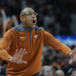
              Texas acting head coach Rodney Terry talks to his players during the second half of an NCAA college basketball game against TCU in Austin, Texas, Wednesday, Jan. 11, 2023. (AP Photo/Eric Gay)
            