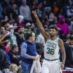
              Boston Celtics guard Marcus Smart (36) waves to the crowd after getting the win against the Charlotte Hornets in the NBA basketball game on Saturday, Jan. 14, 2023, in Charlotte, N.C. (AP Photo/Scott Kinser)
            