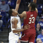 
              South Carolina's Josh Gray (33) shoots while defended by Kentucky's Oscar Tshiebwe, left, during the second half of an NCAA college basketball game in Lexington, Ky., Tuesday, Jan. 10, 2023. South Carolina won 71-68.(AP Photo/James Crisp)
            