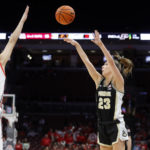 
              Purdue guard Abbey Ellis, right, shoots in front of Ohio State guard Emma Shumate during the first half of an NCAA college basketball game in Columbus, Ohio, Sunday, Jan. 29, 2023. (AP Photo/Paul Vernon)
            