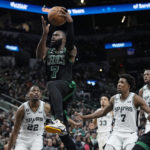 
              Boston Celtics guard Jaylen Brown (7) drives to the basket against the San Antonio Spurs during the first half of an NBA basketball game in San Antonio, Saturday, Jan. 7, 2023. (AP Photo/Eric Gay)
            