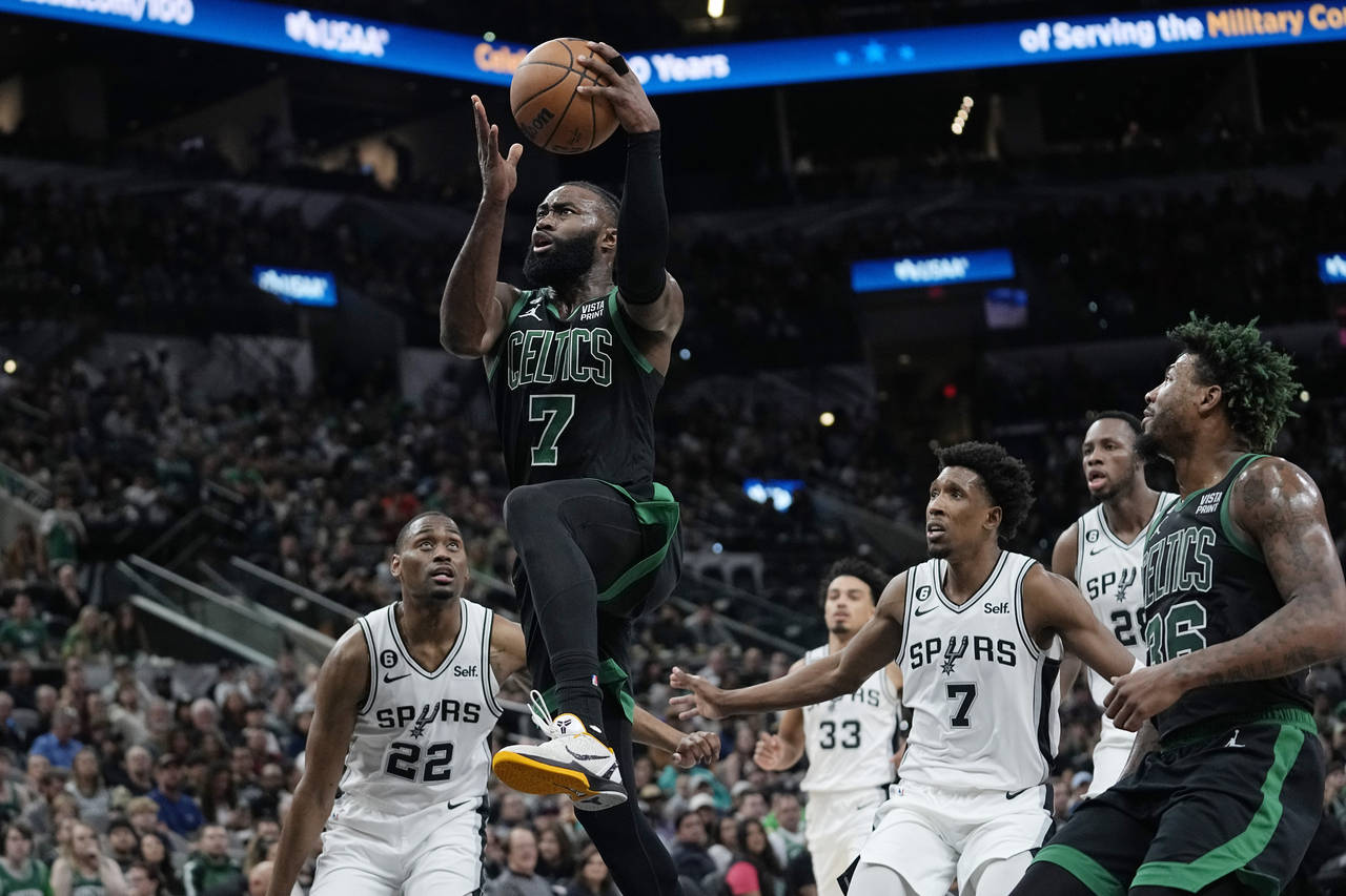 Boston Celtics guard Jaylen Brown (7) drives to the basket against the San Antonio Spurs during the...