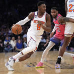 
              New York Knicks guard RJ Barrett (9) drives against Washington Wizards guard Monte Morris (22) during the first half of an NBA basketball game Wednesday, Jan. 18, 2023, at Madison Square Garden in New York. (AP Photo/Mary Altaffer)
            