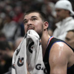 
              Los Angeles Clippers center Ivica Zubac looks at the scoreboard as he sits on the bench during the second half of the team's NBA basketball game against the Utah Jazz on Wednesday, Jan. 18, 2023, in Salt Lake City. (AP Photo/Rick Bowmer)
            