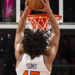 
              New York Knicks center Jericho Sims scores during the second half of an NBA basketball game against the Atlanta Hawks, Friday, Jan. 20, 2023, in Atlanta. (AP Photo/Hakim Wright Sr.)
            