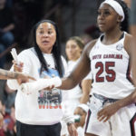 
              South Carolina head coach Dawn Staley communicates with players as South Carolina guard Raven Johnson (25) checks in during the second half of an NCAA college basketball game, Sunday, Jan. 15, 2023, in Columbia, S.C. South Carolina won 81-51. (AP Photo/Sean Rayford)
            