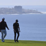 
              Jon Rahm, left, of Spain, and Justin Thomas walk on the fifth hole of the South Course at Torrey Pines during the first round of the Farmers Insurance Open golf tournament Wednesday, Jan. 25, 2023, in San Diego. (AP Photo/Denis Poroy)
            