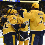 
              Nashville Predators center Thomas Novak (82) celebrates with teammates after scoring a goal against the Montreal Canadiens during the second period of an NHL hockey game Tuesday, Jan. 3, 2023, in Nashville, Tenn. (AP Photo/Mark Zaleski)
            