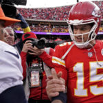 
              Kansas City Chiefs quarterback Patrick Mahomes (15) and Denver Broncos quarterback Russell Wilson (3) greet each other after an NFL football game Sunday, Jan. 1, 2023, in Kansas City, Mo. (AP Photo/Charlie Riedel)
            