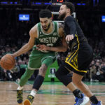 
              Boston Celtics forward Jayson Tatum, left, drives past Golden State Warriors guard Stephen Curry, right, in the second half of an NBA basketball game, Thursday, Jan. 19, 2023, in Boston. (AP Photo/Steven Senne)
            