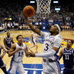 
              Kansas guard Dajuan Harris Jr. (3) puts up a shot during the first half of an NCAA college basketball game against Kansas State Tuesday, Jan. 31, 2023, in Lawrence, Kan. (AP Photo/Charlie Riedel)
            