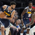 
              Denver Nuggets guard Jamal Murray, left, looks to drive to the rim as New Orleans Pelicans forward Naji Marshall drops back to defend in the second half of an NBA basketball game Tuesday, Jan. 31, 2023, in Denver. (AP Photo/David Zalubowski)
            