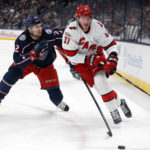 
              Carolina Hurricanes forward Andrei Svechnikov, right, chases the puck in front of Columbus Blue Jackets defenseman Andrew Peeke during the first period of an NHL hockey game in Columbus, Ohio, Saturday, Jan. 7, 2023. (AP Photo/Paul Vernon)
            