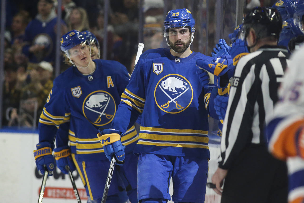 Buffalo Sabres right wing Alex Tuch (89) is congratulated after scoring against the New York Island...