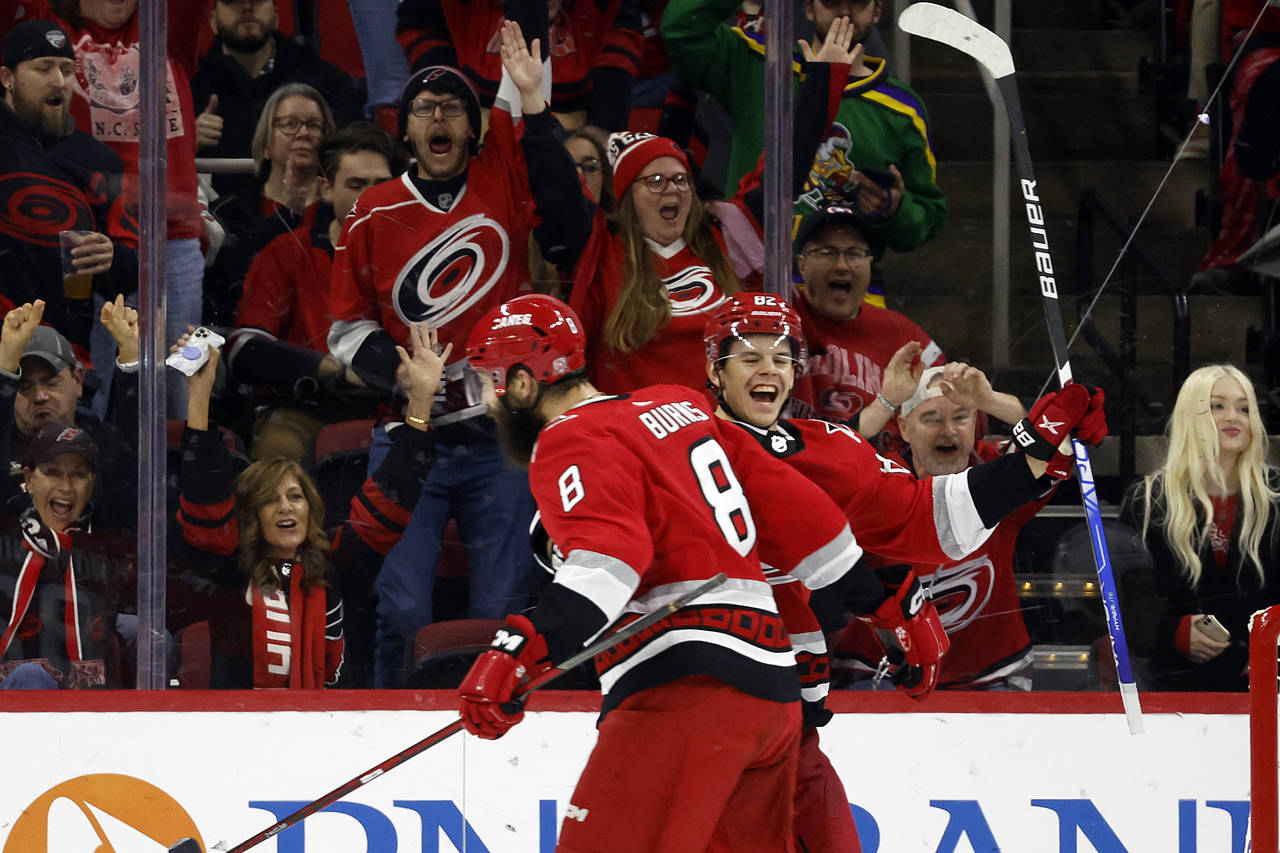 Minnesota Wild Brent Burns, center, celebrates his shootout goal