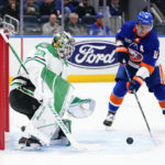 
              Dallas Stars goaltender Jake Oettinger (29) stops a shot on goal by New York Islanders' Josh Bailey (12) during the second period of an NHL hockey game Tuesday, Jan. 10, 2023, in Elmont, N.Y. (AP Photo/Frank Franklin II)
            