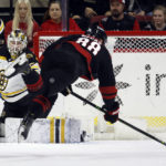 
              Carolina Hurricanes' Martin Necas (88) dives with the puck to attempt to shoot past Boston Bruins goaltender Linus Ullmark (35) during the first period of an NHL hockey game in Raleigh, N.C., Sunday, Jan. 29, 2023. (AP Photo/Karl B DeBlaker)
            