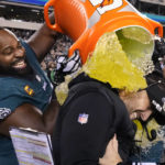 
              Philadelphia Eagles head coach Nick Sirianni, center, is doused by defensive tackle Fletcher Cox (91) and teammates during the second half of the NFC Championship NFL football game between the Philadelphia Eagles and the San Francisco 49ers on Sunday, Jan. 29, 2023, in Philadelphia. (AP Photo/Matt Slocum)
            