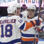 
              New York Islanders left wing Anders Lee (27) celebrates after his goal against the Toronto Maple Leafs with teammates Anthony Beauvillier (18) and Brock Nelson (29) during first-period NHL hockey game action in Toronto, Ontario, Monday, Jan. 23, 2023. (Nathan Denette/The Canadian Press via AP)
            