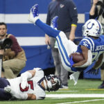 
              Indianapolis Colts running back Deon Jackson is upended with a tackle by Houston Texans safety Jalen Pitre (5) during the first half of an NFL football game between the Houston Texans and Indianapolis Colts, Sunday, Jan. 8, 2023, in Indianapolis. (AP Photo/Darron Cummings)
            