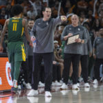 
              Baylor head coach Scott Drew, second from left, speaks to his team as they compete against Texas during the first half of an NCAA college basketball game Monday, Jan. 30, 2023, in Austin, Texas. (AP Photo/Stephen Spillman)
            