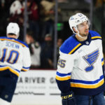 
              St. Louis Blues center Jordan Kyrou (25) and Blues center Brayden Schenn (10) pause on the ice after a goal was scored by Arizona Coyotes' Nick Schmaltz during the second period of an NHL hockey game in Tempe, Ariz., Thursday, Jan. 26, 2023. (AP Photo/Ross D. Franklin)
            