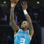 
              Charlotte Hornets guard Terry Rozier shoots against the Boston Celtics during the first half of an NBA basketball game in Charlotte, N.C., Monday, Jan. 16, 2023. (AP Photo/Nell Redmond)
            