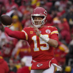 
              Kansas City Chiefs quarterback Patrick Mahomes (15) passes against the Jacksonville Jaguars during the first half of an NFL divisional round playoff football game, Saturday, Jan. 21, 2023, in Kansas City, Mo. (AP Photo/Ed Zurga)
            