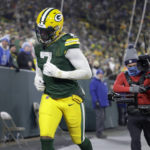 
              Green Bay Packers linebacker Quay Walker runs off the field after being ejected during the second half of an NFL football game against the Detroit Lions Sunday, Jan. 8, 2023, in Green Bay, Wis. (AP Photo/Matt Ludtke)
            