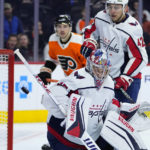 
              Washington Capitals' Darcy Kuemper deflects a shot during the second period of an NHL hockey game against the Philadelphia Flyers, Wednesday, Jan. 11, 2023, in Philadelphia. (AP Photo/Matt Slocum)
            