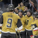 
              Vegas Golden Knights right wing Mark Stone, second from right, celebrates his goal with center Jack Eichel (9), defenseman Brayden McNabb, second from left, right wing Reilly Smith during the second period of the team's NHL hockey game against the Pittsburgh Penguins on Thursday, Jan. 5, 2023, in Las Vegas. (AP Photo/Ellen Schmidt)
            