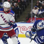 
              Toronto Maple Leafs goaltender Ilya Samsonov (35) makes a save as New York Rangers forward Filip Chytil (72) watches during the third period of an NHL hockey game Wednesday, Jan. 25, 2023, in Toronto. (Nathan Denette/The Canadian Press via AP)
            