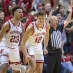 
              Indiana forwards Trayce Jackson-Davis (23) and Miller Kopp (12) react after a 3-point basket by Kopp during the first half an NCAA college basketball game against Northwestern, Sunday, Jan. 8, 2023, in Bloomington, Ind. (AP Photo/Doug McSchooler)
            
