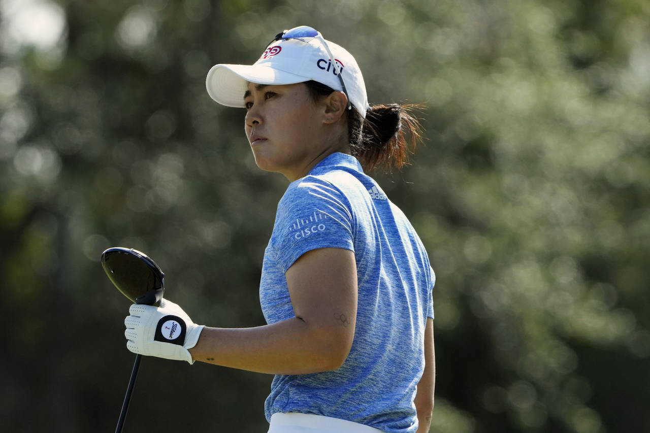 FILE -Danielle Kang watches her shot from the third tee during the third round of the LPGA CME Grou...