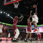 
              Houston's Jarace Walker (25) goes up for a shot as Temple's Zach Hicks (24) defends during the first half of an NCAA college basketball game Sunday, Jan. 22, 2023, in Houston. (AP Photo/David J. Phillip)
            