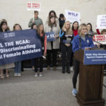 
              Former University of Kentucky swimmer Riley Gaines, right, speaks during a rally on Thursday, Jan. 12, 2023, outside of the NCAA Convention in San Antonio. (AP Photo/Darren Abate)
            