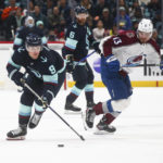 
              Seattle Kraken center Ryan Donato (9) is defended by Colorado Avalanche right wing Valeri Nichushkin (13) during the second period of an NHL hockey game Saturday, Jan. 21, 2023, in Seattle. (AP Photo/Lindsey Wasson)
            