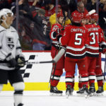 
              The Carolina Hurricanes celebrate a goal by Brent Burns during the first period of an NHL hockey game against the Los Angeles Kings in Raleigh, N.C., Tuesday, Jan. 31, 2023. (AP Photo/Karl B DeBlaker)
            