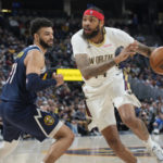 
              New Orleans Pelicans forward Brandon Ingram, right, drives to the rim past Denver Nuggets guard Jamal Murray in the second half of an NBA basketball game Tuesday, Jan. 31, 2023, in Denver. (AP Photo/David Zalubowski)
            