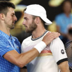 
              Novak Djokovic, left, of Serbia is congratulated by Tommy Paul of the U.S. after their semifinal at the Australian Open tennis championship in Melbourne, Australia, Friday, Jan. 27, 2023. (AP Photo/Asanka Brendon Ratnayake)
            