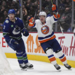 
              New York Islanders' Casey Cizikas, right, celebrates his goal as he skates past Vancouver Canucks' Luke Schenn during the third period of an NHL hockey game Tuesday, Jan. 3, 2023, in Vancouver, British Columbia. (Darryl Dyck/The Canadian Press via AP)
            