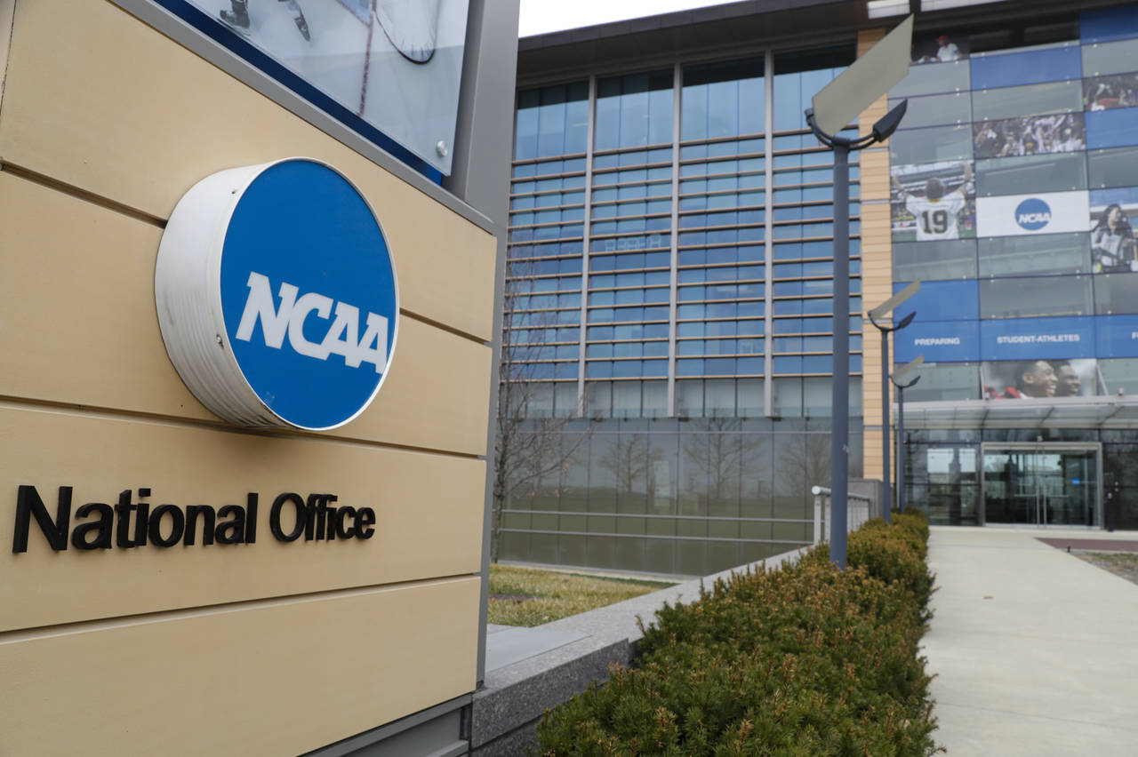 FILE - This is a March 12, 2020, file photo showing NCAA headquarters in Indianapolis. The NCAA and...