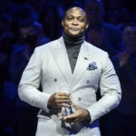 
              Eddie George, right, accepts the 18th annual National Civil Rights Museum Sports Legacy Award along with fellow honorees Gary Payton, Luol Deng, and Nancy Leiberman before the 21st annual Martin Luther King Jr. Day Celebration Game between the Phoenix Suns and the Memphis Grizzlies, Monday, Jan. 16, 2023, in Memphis, Tenn. (AP Photo/Brandon Dill)
            