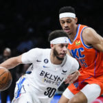 
              Brooklyn Nets' Seth Curry (30) drives past Oklahoma City Thunder's Darius Bazley, right, during the first half of an NBA basketball game Sunday, Jan. 15, 2023, in New York. (AP Photo/Frank Franklin II)
            