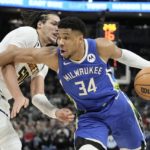 
              Milwaukee Bucks' Giannis Antetokounmpo is fouled by Denver Nuggets' Aaron Gordon during the second half of an NBA basketball game Wednesday, Jan. 25, 2023, in Milwaukee. The Bucks won 107-99. (AP Photo/Morry Gash)
            