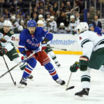 
              New York Rangers left wing Artemi Panarin (10) skates against Minnesota Wild center Connor Dewar (26) and defenseman Jon Merrill (4) during the second period of an NHL hockey game, Tuesday, Jan. 10, 2023, at Madison Square Garden in New York. (AP Photo/Mary Altaffer)
            