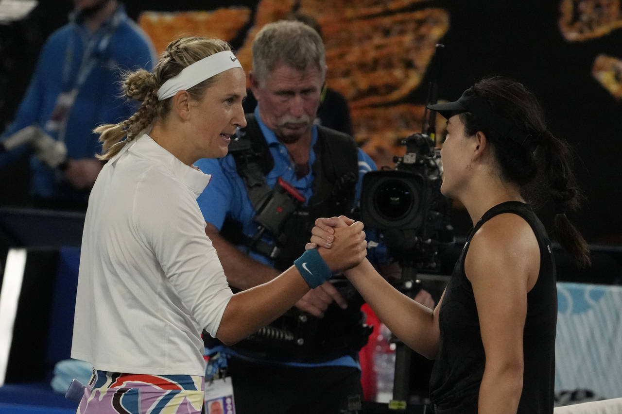 Victoria Azarenka of Belarus, left, is congratulated by Zhu Lin of China fo0llowing her victory in ...