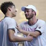 
              Tommy Paul, right, of the U.S. is congratulated by compatriot Ben Shelton following their quarterfinal match at the Australian Open tennis championship in Melbourne, Australia, Wednesday, Jan. 25, 2023.(AP Photo/Dita Alangkara)
            